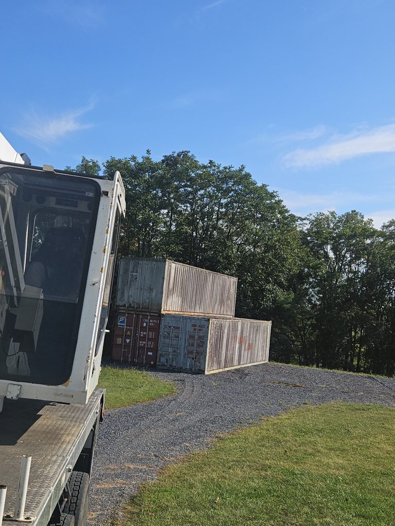 L&L stacks shipping containers.