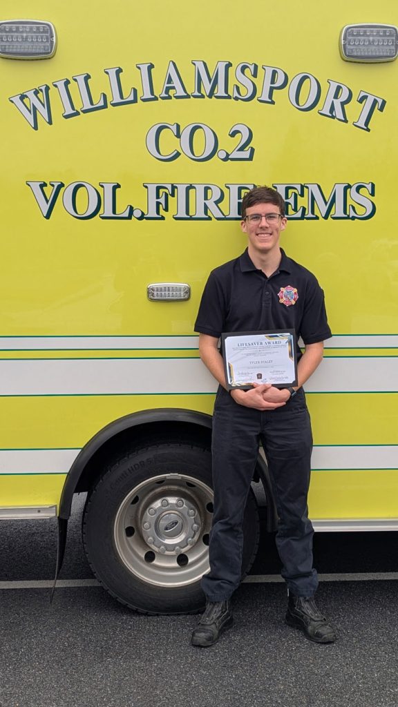 Tyler Staley holding the Life Saver Award